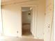 View into a storage room featuring white walls, shelving, and a concrete floor at 1019 E Granada Ave, Apache Junction, AZ 85119