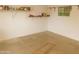 Small storage area with shelving, paint cans, and concrete floors at 1019 E Granada Ave, Apache Junction, AZ 85119