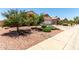 Charming single-story home featuring desert landscaping and a two-car garage at 11023 W Chino Dr, Peoria, AZ 85373