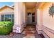 Inviting front entrance with tiled porch and decorative landscaping at 11023 W Chino Dr, Peoria, AZ 85373