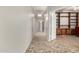 Hallway with tile flooring leading to additional rooms at 11023 W Chino Dr, Peoria, AZ 85373