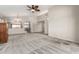 Spacious living room featuring carpet, ceiling fan, and ample natural light at 11023 W Chino Dr, Peoria, AZ 85373