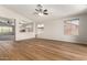 Bright living room showcasing wood floors, large windows, and an airy atmosphere at 11023 W Chino Dr, Peoria, AZ 85373