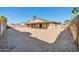 Expansive backyard with a covered patio, offering a perfect space for relaxation and entertaining at 11044 N 75Th Dr, Peoria, AZ 85345