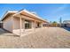 Scenic backyard featuring a spacious covered patio and low-maintenance landscaping, perfect for outdoor living at 11044 N 75Th Dr, Peoria, AZ 85345