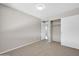 Comfortable bedroom with neutral carpeting, ample storage, and access to other rooms in the house at 11044 N 75Th Dr, Peoria, AZ 85345