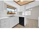 Bright kitchen featuring white cabinets, a stainless steel sink, and a window view at 11044 N 75Th Dr, Peoria, AZ 85345