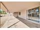 Covered patio with concrete flooring and sliding glass door leading to the interior, ideal for entertaining at 11044 N 75Th Dr, Peoria, AZ 85345