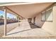 Covered patio featuring a concrete floor and view of the gravel backyard, offering shade and outdoor space at 11044 N 75Th Dr, Peoria, AZ 85345