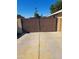 A driveway gate protects the cars parked on the concrete driveway at 1160 W Ivanhoe St, Chandler, AZ 85224