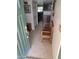 Welcoming foyer featuring tile flooring, a wooden bench, and a glimpse into the home's interior at 1160 W Ivanhoe St, Chandler, AZ 85224