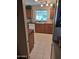 Well-lit kitchen featuring warm wood cabinetry and tile flooring at 1160 W Ivanhoe St, Chandler, AZ 85224
