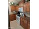 Cozy kitchen with warm wood cabinets and modern appliances at 1160 W Ivanhoe St, Chandler, AZ 85224
