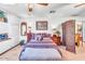 Comfortable bedroom featuring a ceiling fan, complementary decor, and a decorative room divider at 1179 E Cordova Ave, Casa Grande, AZ 85122