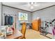 Functional bedroom with workout equipment and a ceiling fan at 1179 E Cordova Ave, Casa Grande, AZ 85122