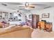 Bright bedroom showcases built-in shelves, a decorative screen, desk, chair, and relaxing seating at 1179 E Cordova Ave, Casa Grande, AZ 85122