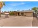 Inviting single-level home with a charming front porch and ample parking space at 1179 E Cordova Ave, Casa Grande, AZ 85122