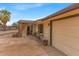 Close up shot of a home exterior with a charming porch and attached garage at 1179 E Cordova Ave, Casa Grande, AZ 85122