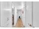 Bright hallway featuring white walls and multiple storage cabinets at 1179 E Cordova Ave, Casa Grande, AZ 85122