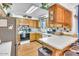 Kitchen featuring light oak cabinets, a white countertop, and a breakfast bar at 1179 E Cordova Ave, Casa Grande, AZ 85122