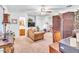 Cozy living room with vintage furnishings and decor touches, adjacent to bathroom at 1179 E Cordova Ave, Casa Grande, AZ 85122