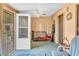 Bright sunroom featuring cozy seating, fan and lots of light at 1179 E Cordova Ave, Casa Grande, AZ 85122