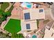 Aerial view of a home with solar panels, a pool, and a well-maintained backyard at 1203 W Escuda Rd, Phoenix, AZ 85027