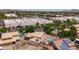 Aerial view of a neighborhood home with dual pools, solar panels, and a lush backyard oasis at 1203 W Escuda Rd, Phoenix, AZ 85027