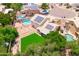 Aerial view of home with a pool, large backyard, outdoor living spaces, and solar panels at 1203 W Escuda Rd, Phoenix, AZ 85027