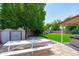 Backyard with shed, picnic table, hot tub and artificial grass, perfect for outdoor relaxation and activities at 1203 W Escuda Rd, Phoenix, AZ 85027