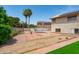 Spacious backyard with a pool, desert landscaping, and play structures, perfect for outdoor activities at 1203 W Escuda Rd, Phoenix, AZ 85027