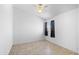Neutral bedroom features tile floors, window with curtains for privacy, and neutral color palette at 1203 W Escuda Rd, Phoenix, AZ 85027