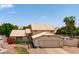 Charming home exterior with a well-manicured lawn and mature trees, offering great curb appeal at 1203 W Escuda Rd, Phoenix, AZ 85027