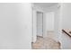Hallway with tile flooring leading to multiple rooms, offering a bright and open feel at 1203 W Escuda Rd, Phoenix, AZ 85027