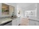 Well-lit kitchen with stainless steel appliances, white cabinets, and a view of the backyard at 1203 W Escuda Rd, Phoenix, AZ 85027