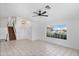 Spacious living room with tile floors, white walls, and natural light, showcasing the home's welcoming ambiance at 1203 W Escuda Rd, Phoenix, AZ 85027