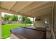 Inviting covered patio with a hot tub, offering a relaxing outdoor retreat and backyard views at 1203 W Escuda Rd, Phoenix, AZ 85027