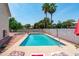 Inviting backyard pool with lounge seating and shade, offering a refreshing escape from the summer heat at 1203 W Escuda Rd, Phoenix, AZ 85027