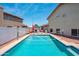 Backyard pool with lounge seating and volleyball net, perfect for relaxation and outdoor activities at 1203 W Escuda Rd, Phoenix, AZ 85027