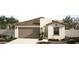 Charming single-story home with a well-maintained yard and a two-car garage at 18180 W Larkspur Dr, Goodyear, AZ 85338