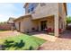 Exterior shot of backyard featuring artificial turf and covered patio at 18877 E Pelican Dr, Queen Creek, AZ 85142
