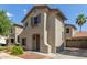 Two-story home with neutral stucco, an attached two-car garage and low maintenance landscaping at 18877 E Pelican Dr, Queen Creek, AZ 85142