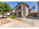 Two-story home with neutral stucco, an attached two-car garage and low maintenance landscaping at 18877 E Pelican Dr, Queen Creek, AZ 85142
