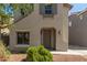 Two-story home showcasing a well-manicured front yard with decorative rock and shrubbery at 18877 E Pelican Dr, Queen Creek, AZ 85142