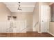 Upstairs hallway featuring hardwood floors and a chandelier hanging from the ceiling at 18877 E Pelican Dr, Queen Creek, AZ 85142