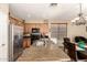 Bright kitchen with wooden cabinets, granite countertops, stainless steel appliances and a large island with a sink at 18877 E Pelican Dr, Queen Creek, AZ 85142