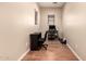 An office space featuring hardwood floors, dual windows, and a desk area at 18877 E Pelican Dr, Queen Creek, AZ 85142