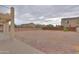 Large gravel backyard surrounded by block wall fencing, offering privacy at 2194 N Magdelena Pl, Casa Grande, AZ 85122