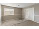 Spacious bedroom features large window, neutral tones, and a doorway to a walk-in closet at 2194 N Magdelena Pl, Casa Grande, AZ 85122