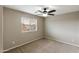 Cozy bedroom featuring a ceiling fan and a window with bright outdoor views at 2194 N Magdelena Pl, Casa Grande, AZ 85122